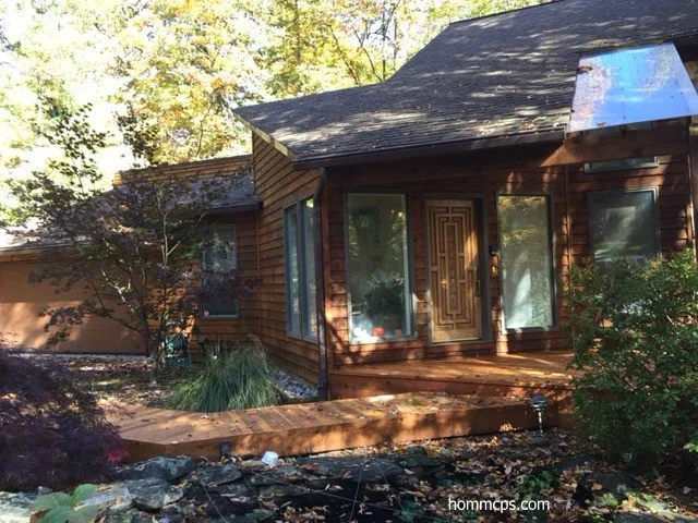 Cedar siding exterior re-staining in Reston, VA by Hömm Certified Painting Systems - Photo 2