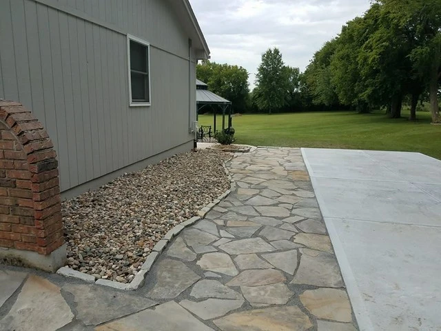 Flagstone walkway by Garden Gate Lawn & Landscape, LLC - Photo 2