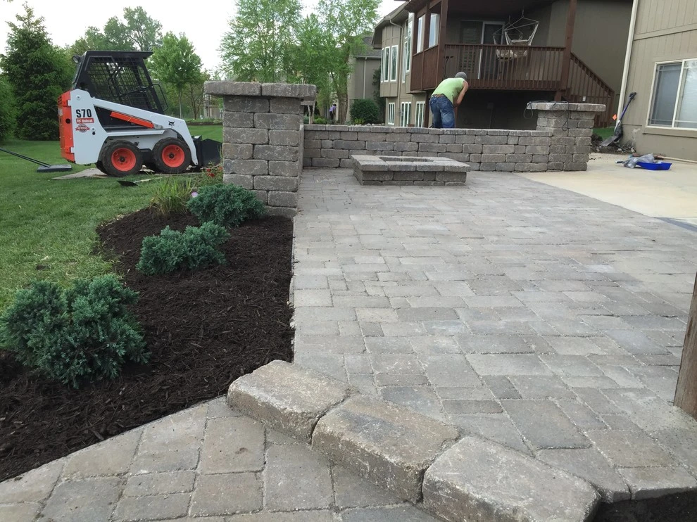 Paver patio, sitting wall, fireplace and outdoor lighting by Garden Gate Lawn & Landscape, LLC - Photo 4