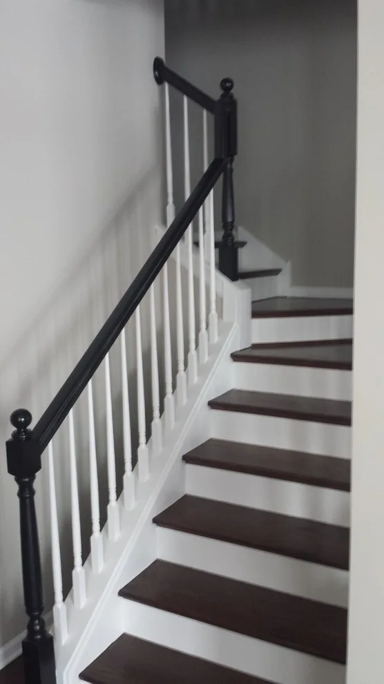 Dark handrails and light trim by Custom Colors Painting & Wallpapering, Inc. - Photo 2