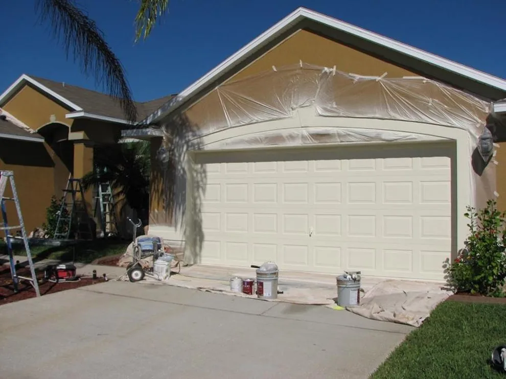 Garage door refurbishment by AVR Painting Services Inc. - Photo 2