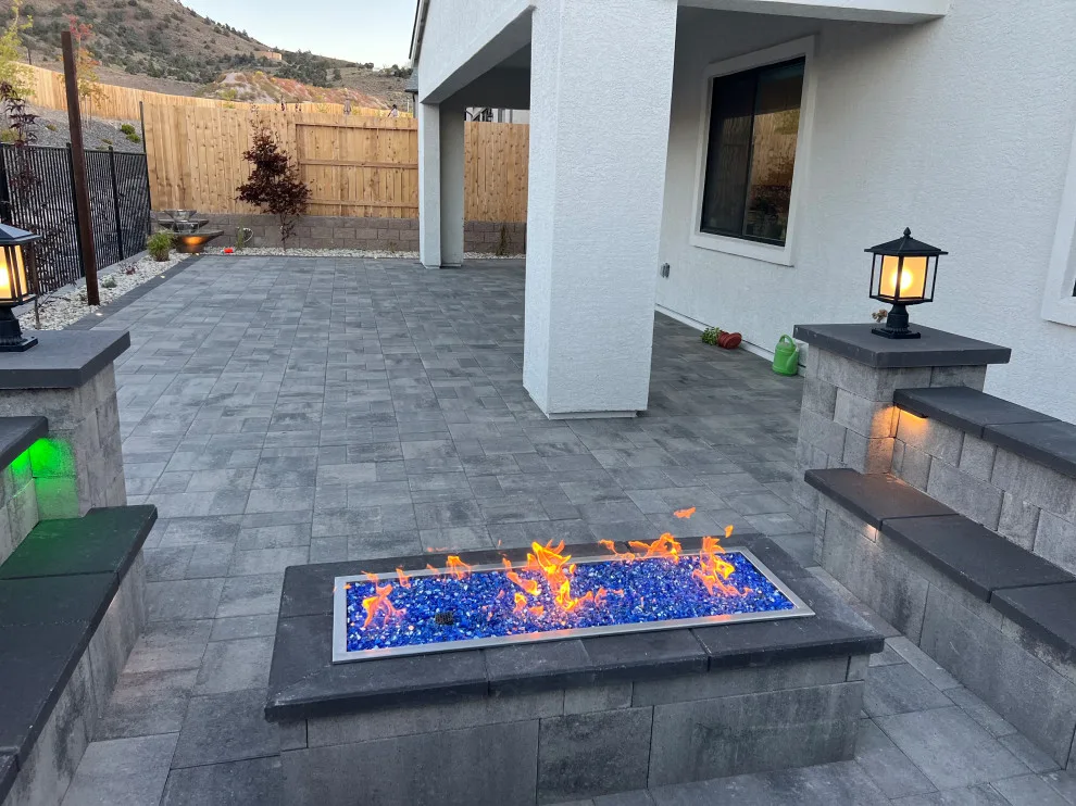 Outdoor space featuring a gas fire pit by Jefe's Landscaping - Photo 2