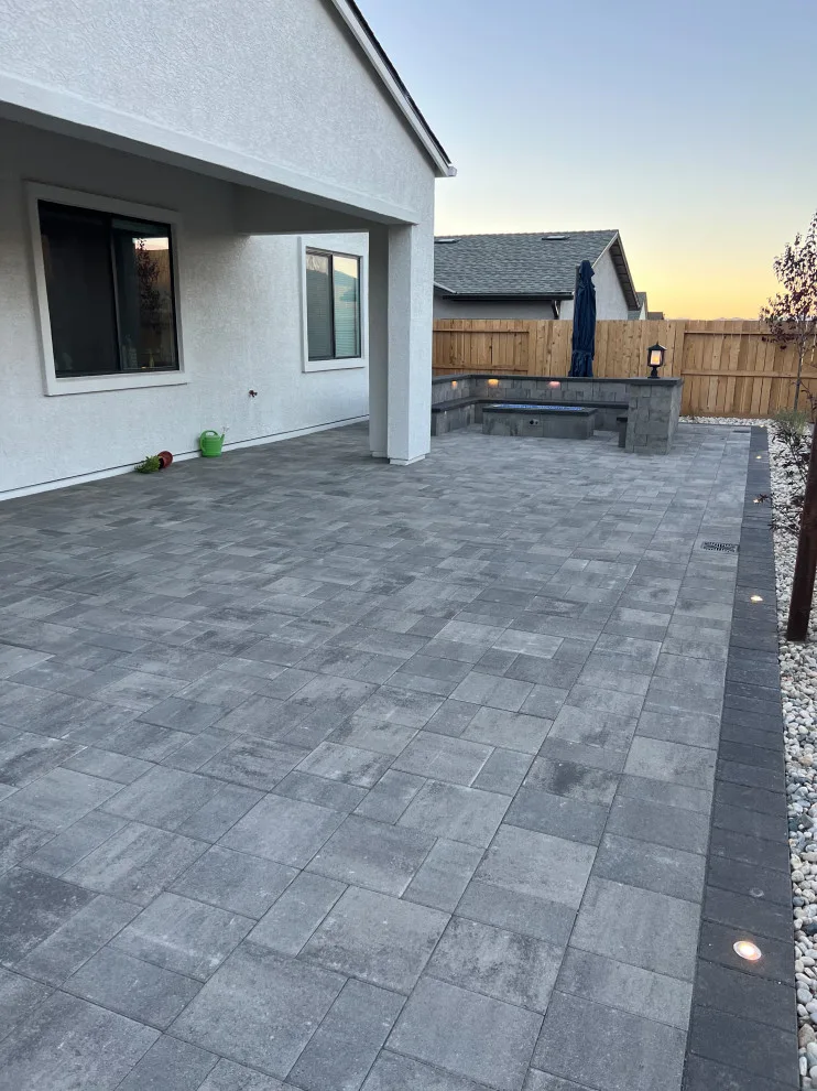 Outdoor space featuring a gas fire pit by Jefe's Landscaping - Photo 8