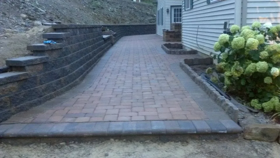 Extensive Retaining Wall and Outdoor Space Renovation by Shaylor's Ponds & Patios - Photo 10