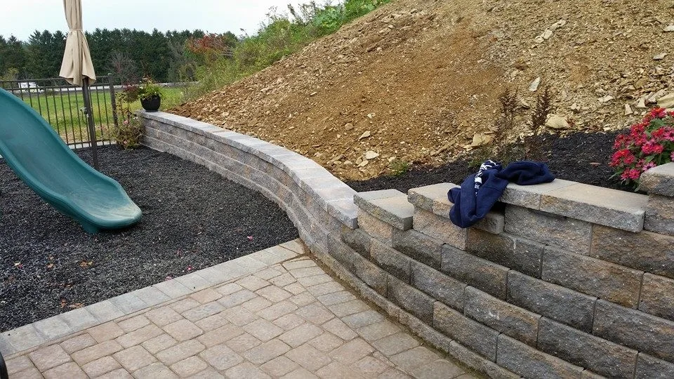 Extensive Retaining Wall and Outdoor Space Renovation by Shaylor's Ponds & Patios - Photo 7