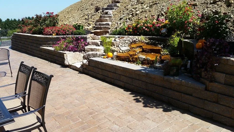 Extensive Retaining Wall and Outdoor Space Renovation by Shaylor's Ponds & Patios - Photo 2