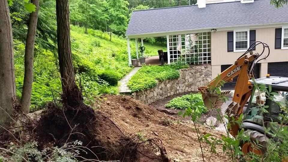 Expansive Retaining Wall and Landscape Transformation by Shaylor's Ponds & Patios - Photo 3