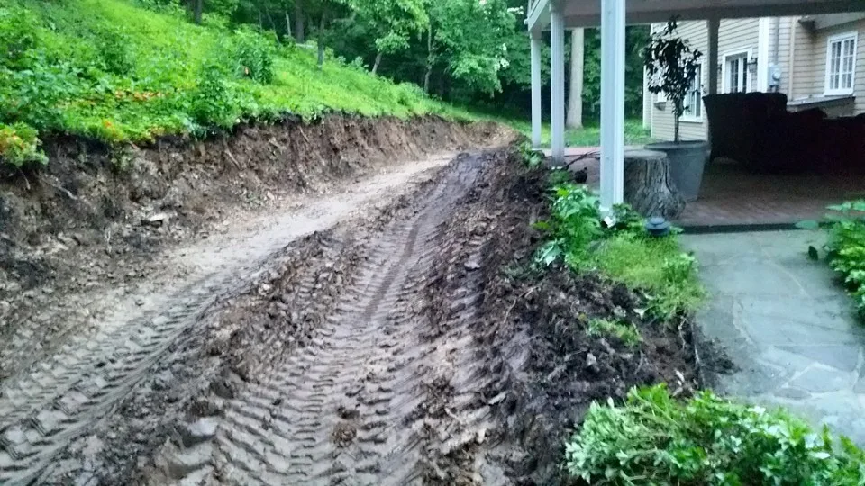 Expansive Retaining Wall and Landscape Transformation by Shaylor's Ponds & Patios - Photo 2
