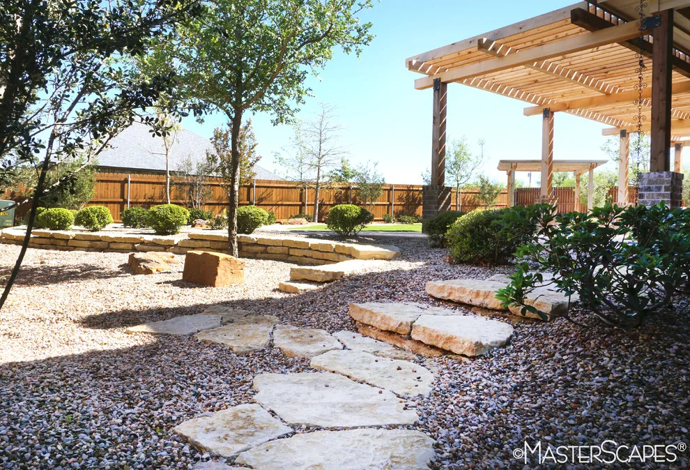 Outdoor Space with Pergola and Drought-Resistant Flowerbeds by MasterScapes - Photo 4