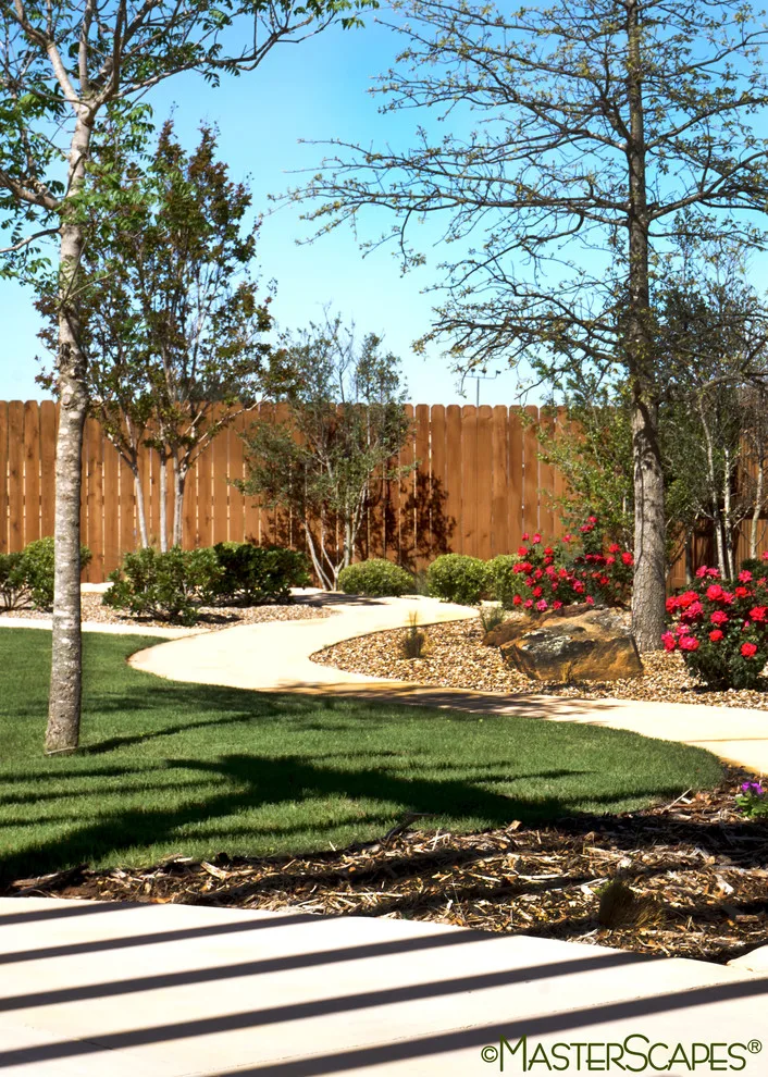 Outdoor Space with Pergola and Drought-Resistant Flowerbeds by MasterScapes - Photo 2