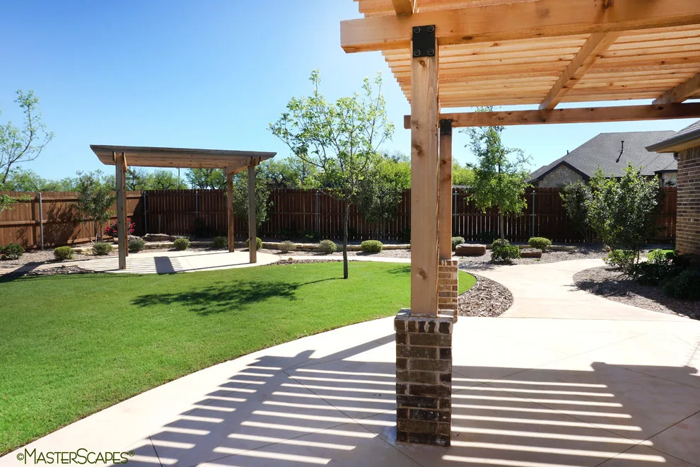 Outdoor Space with Pergola and Drought-Resistant Flowerbeds by MasterScapes - Photo 8
