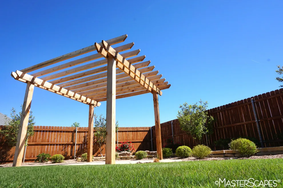 Outdoor Space with Pergola and Drought-Resistant Flowerbeds by MasterScapes - Photo 7