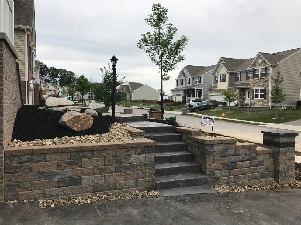 Stunning Stamped Concrete and Retaining Wall Transformation by Schellhaas Landscape Construction - Photo 2