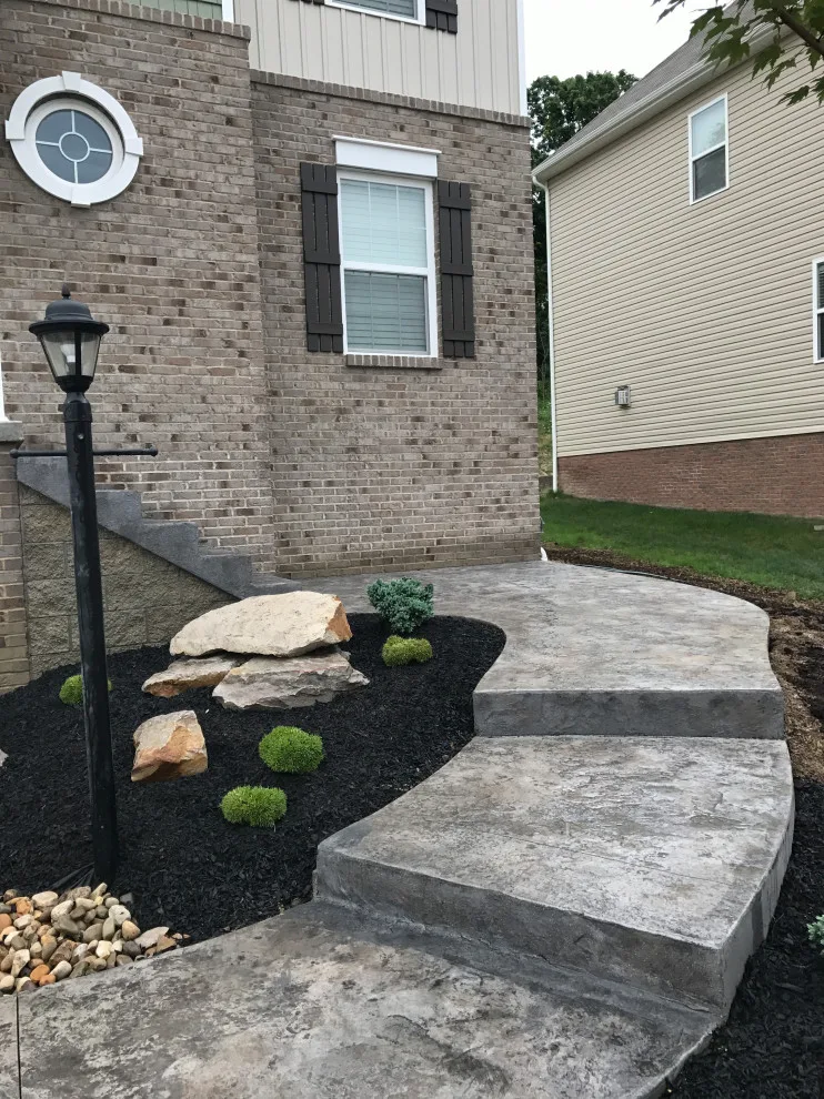 Stunning Stamped Concrete and Retaining Wall Transformation by Schellhaas Landscape Construction - Photo 3