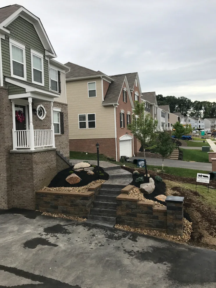 Stunning Stamped Concrete and Retaining Wall Transformation by Schellhaas Landscape Construction - Photo 4