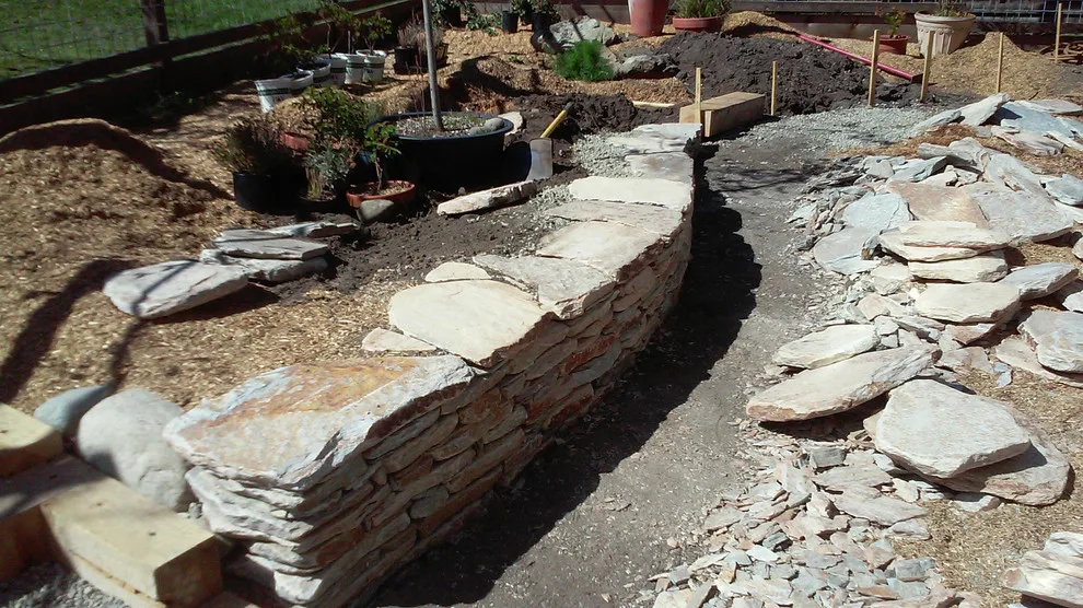Stacked stone wall by Fire Sparrow Landscaping - Photo 2