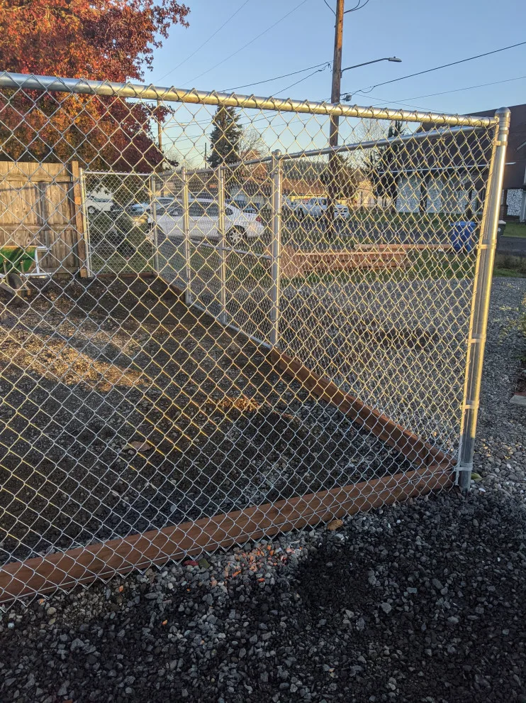 Installation of galvanized chain link fencing by All Seasons Landscaping Of Mason County LLC - Photo 3