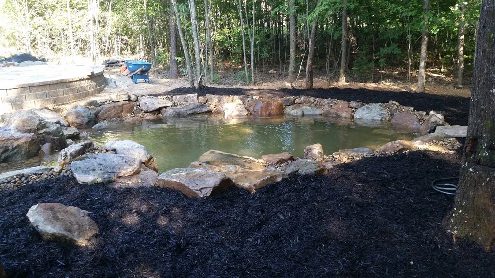 Layered Patio with Koi Pond and Water Features by McCormick Landscaping / Aquatic Solutions - Photo 2