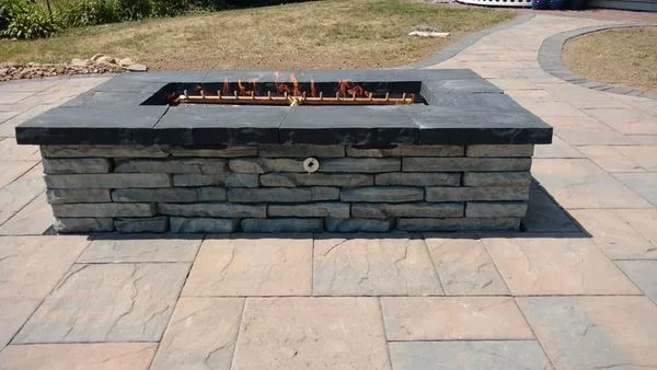 Outdoor space featuring a gas fire pit by Marlinski Landscape & Stone Work - Photo 3