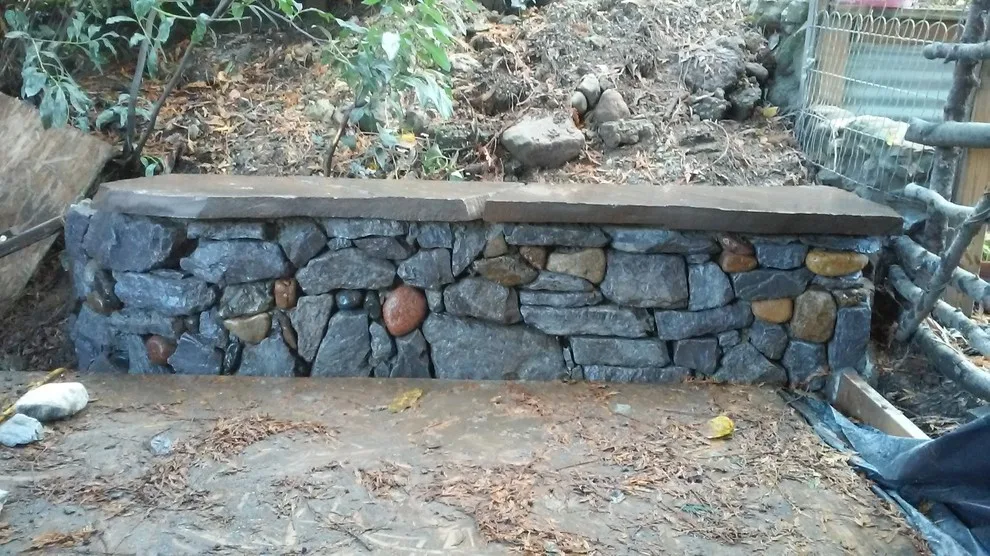 Layered stone barriers by Fire Sparrow Landscaping - Photo 5