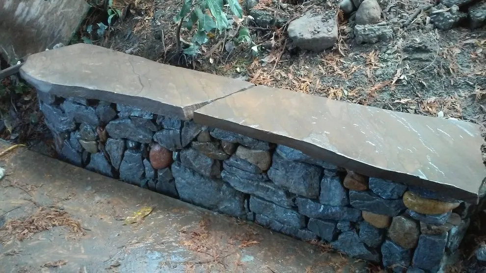 Layered stone barriers by Fire Sparrow Landscaping - Photo 4
