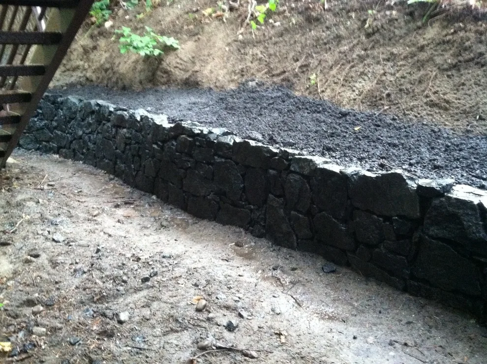 Layered stone barriers by Fire Sparrow Landscaping - Photo 3