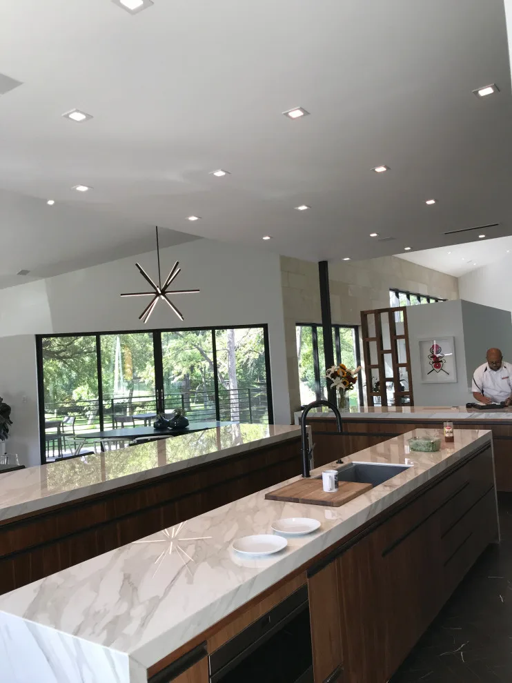 Contemporary Walnut Kitchen Featuring Three Islands by Servigon Construction Group - Photo 5