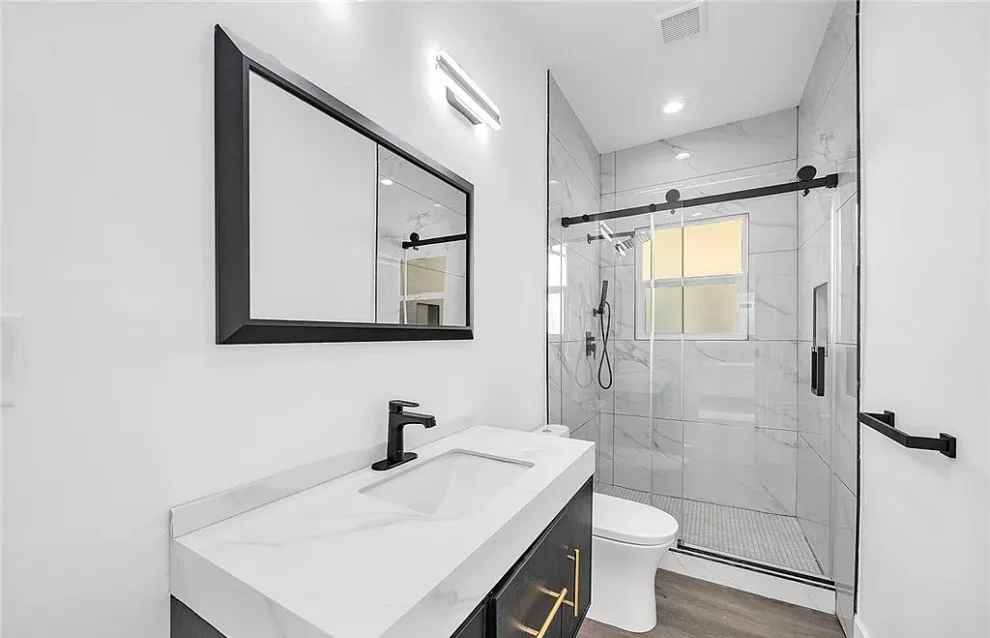 Contemporary House Remodeling by Build Construction Corporation - Photo 3