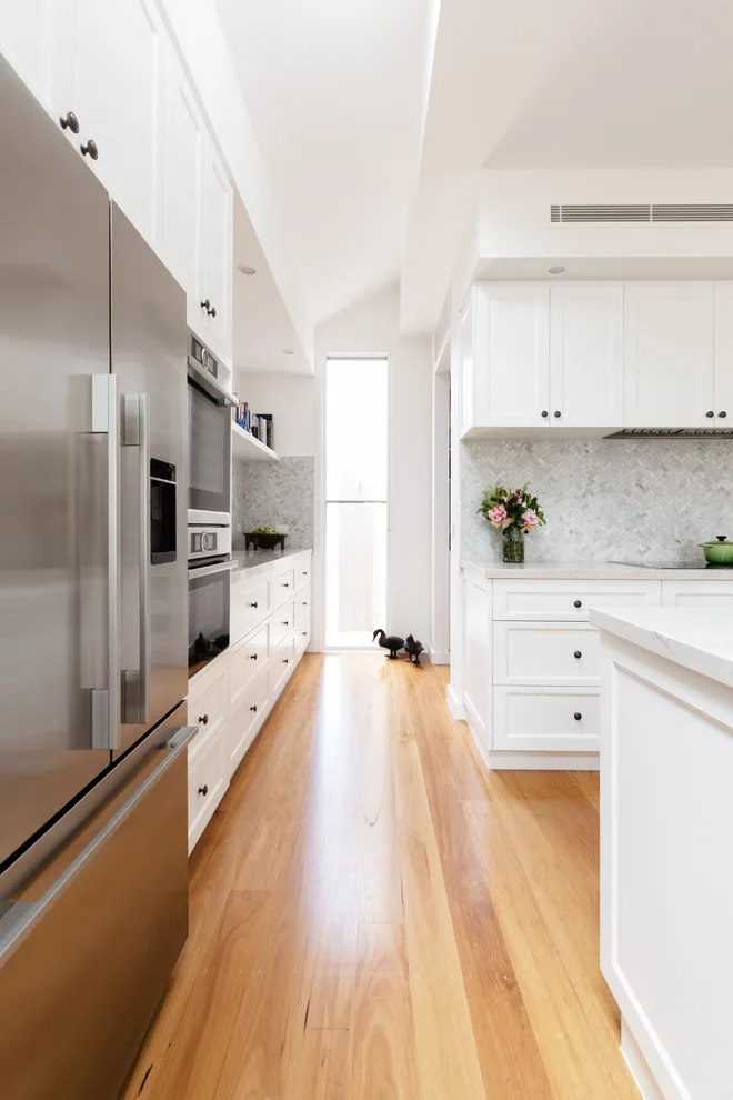 Impeccably White Kitchen by Kitchen Master Design & Remodeling LLC - Photo 6