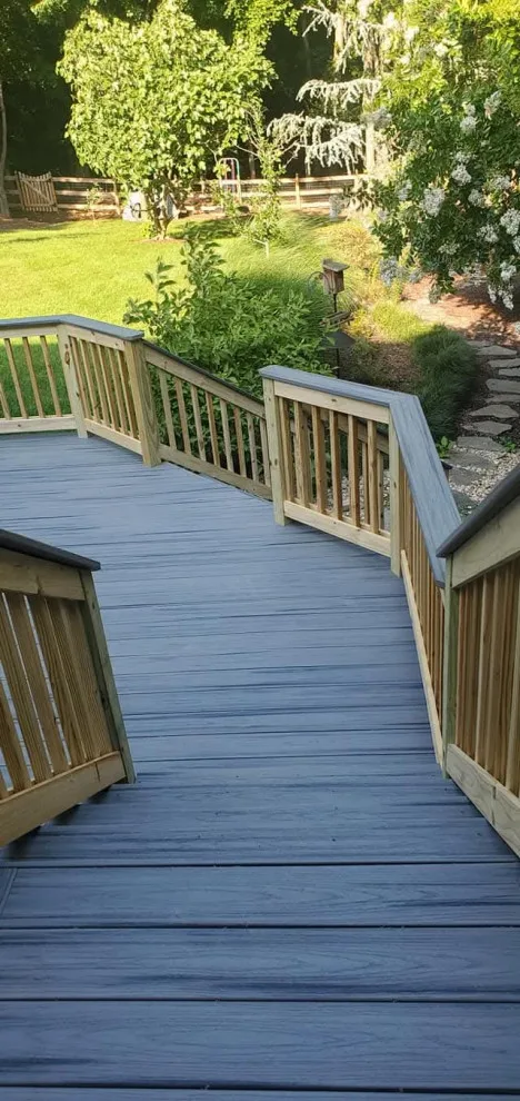 Multi-tiered deck with a sheltered patio by Grand Outdoor Living Design - Photo 3