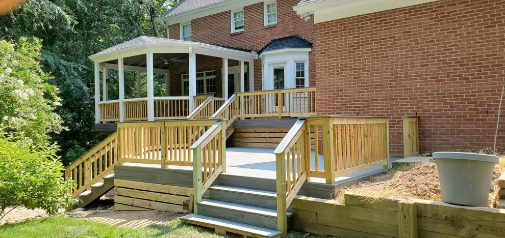 Multi-tiered deck with a sheltered patio by Grand Outdoor Living Design - Photo 2