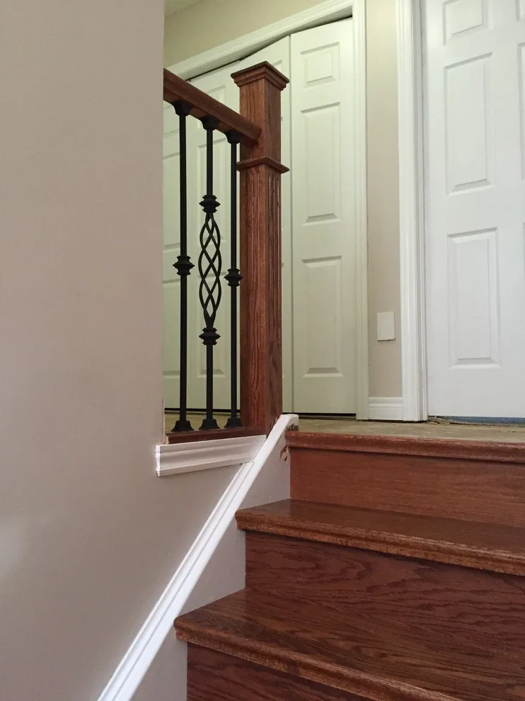 Updated staircase with handrail and wrought iron balusters by Buildby7 LLC - Photo 5