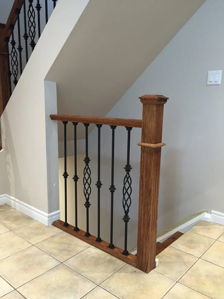Updated staircase with handrail and wrought iron balusters by Buildby7 LLC - Photo 7