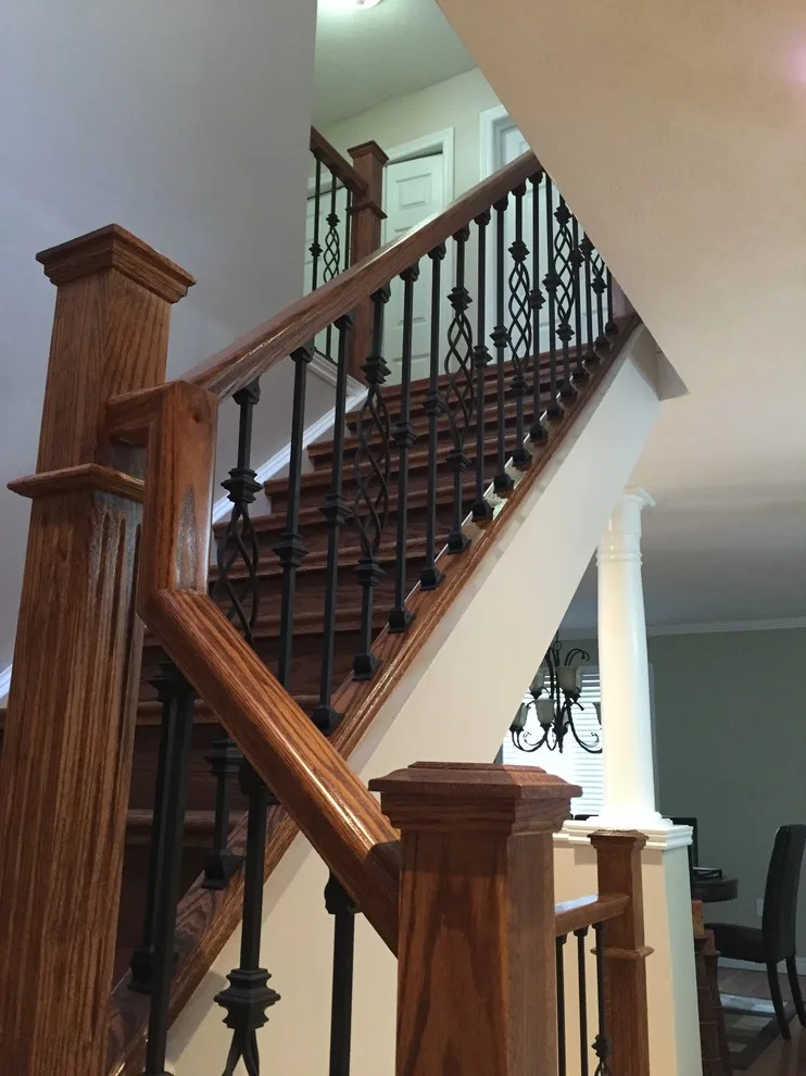 Updated staircase with handrail and wrought iron balusters by Buildby7 LLC - Photo 6