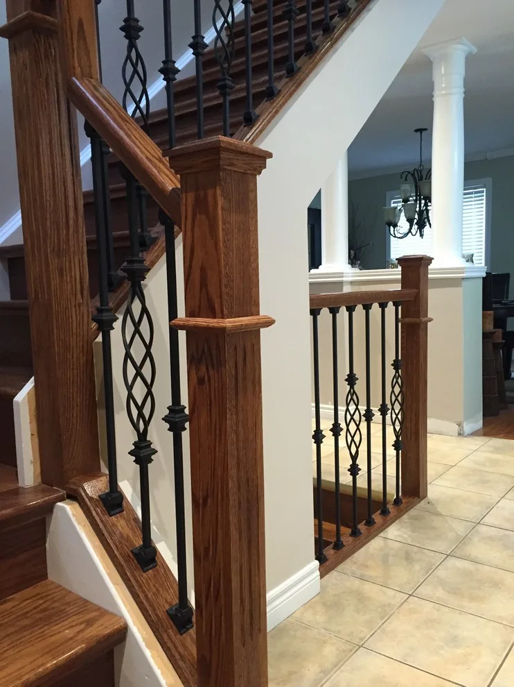 Updated staircase with handrail and wrought iron balusters by Buildby7 LLC - Photo 4