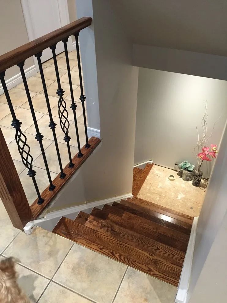 Updated staircase with handrail and wrought iron balusters by Buildby7 LLC - Photo 3
