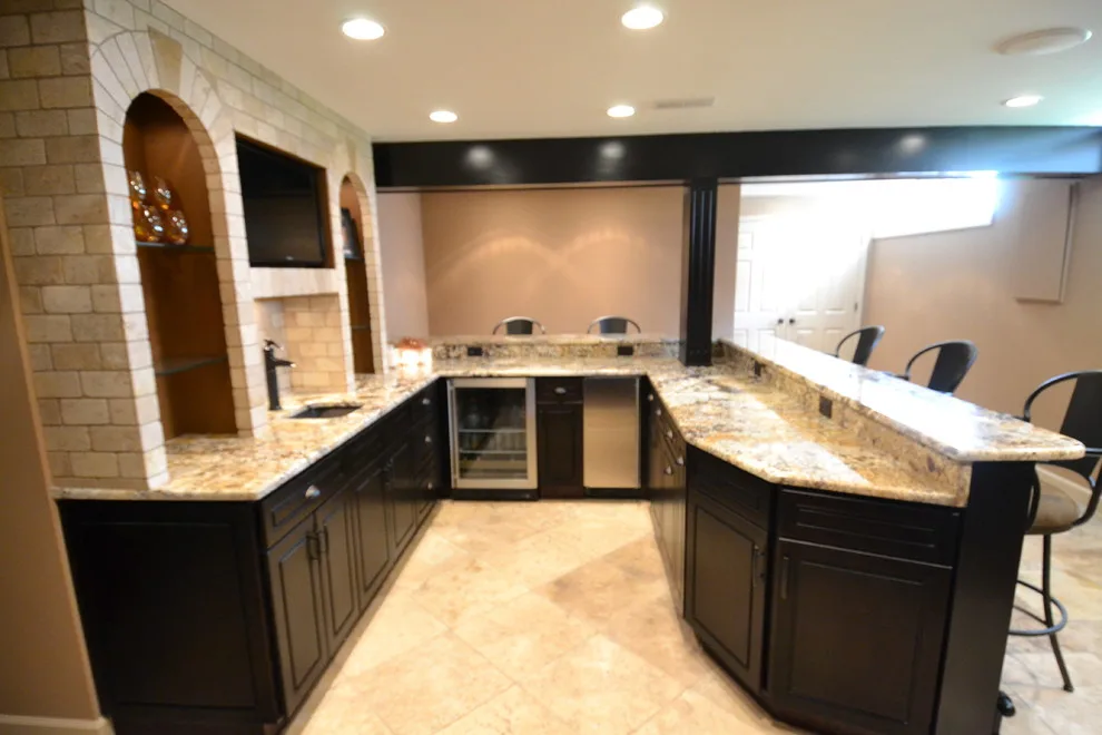 Walker basement renovation with wet bar by Remodeling And Painting Experts Inc. - Photo 8