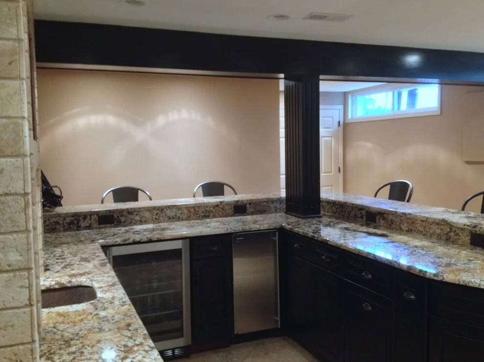 Walker basement renovation with wet bar by Remodeling And Painting Experts Inc. - Photo 16