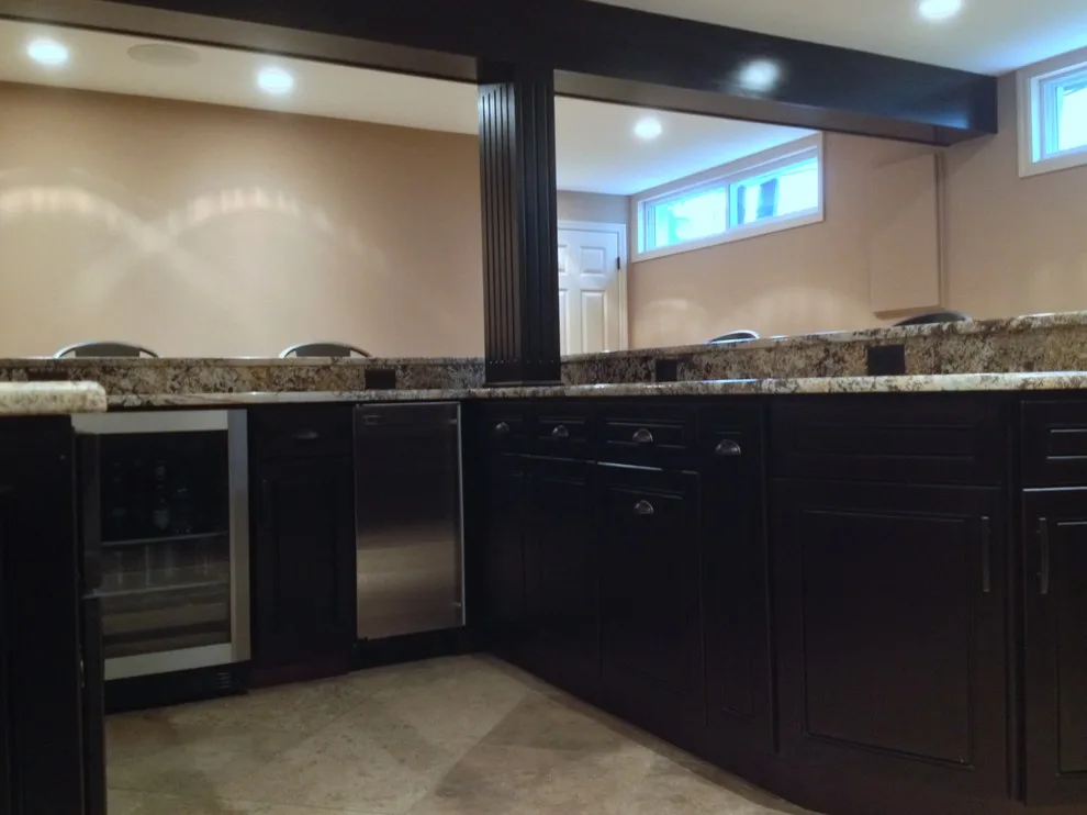 Walker basement renovation with wet bar by Remodeling And Painting Experts Inc. - Photo 5