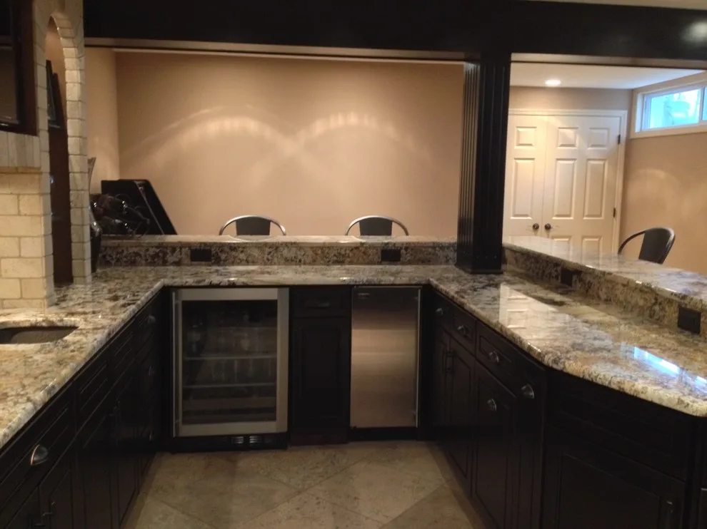 Walker basement renovation with wet bar by Remodeling And Painting Experts Inc. - Photo 20