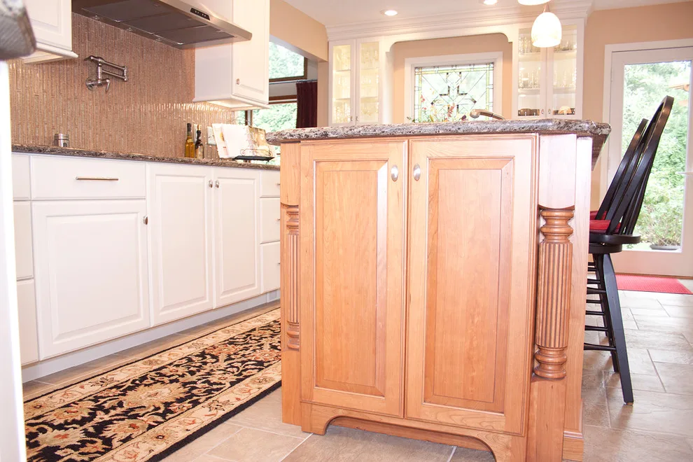 Contrasting Island in a White Kitchen by Kitchens & Interiors, Inc. - Photo 12