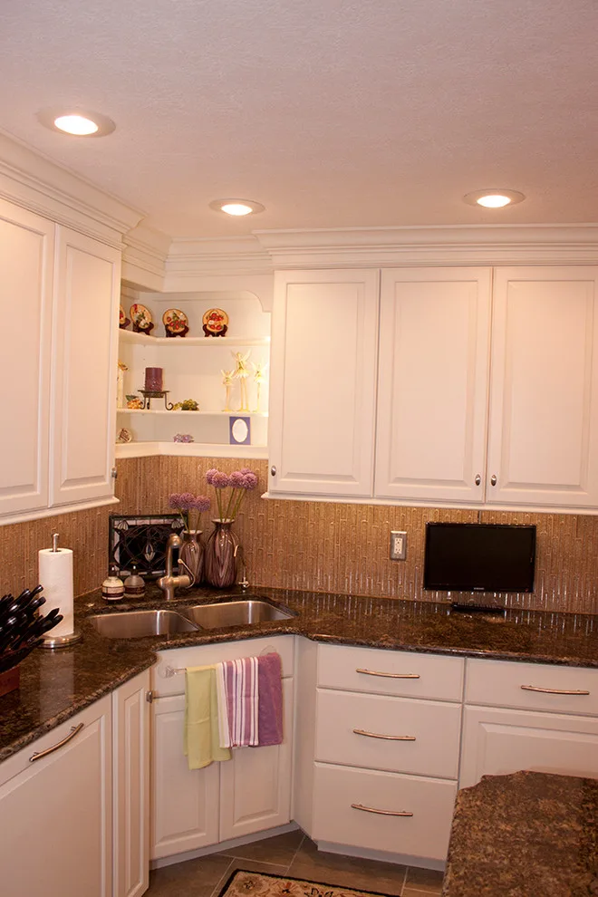 Contrasting Island in a White Kitchen by Kitchens & Interiors, Inc. - Photo 17