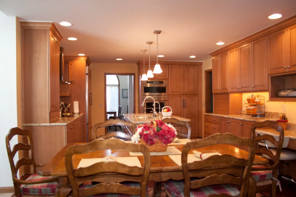 Ceiling-Height Granite Backsplash Kitchen by Kitchens & Interiors, Inc. - Photo 2