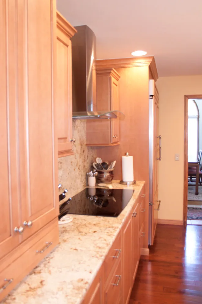 Ceiling-Height Granite Backsplash Kitchen by Kitchens & Interiors, Inc. - Photo 9