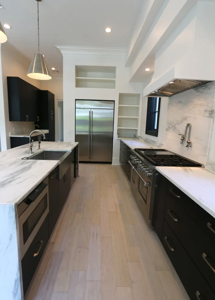 Modern Kitchen Design Featuring a Marble Waterfall Countertop by Classic Cupboards, Inc - Photo 7