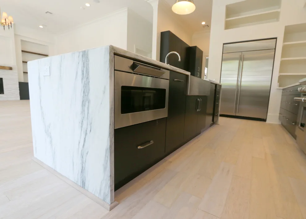 Modern Kitchen Design Featuring a Marble Waterfall Countertop by Classic Cupboards, Inc - Photo 9