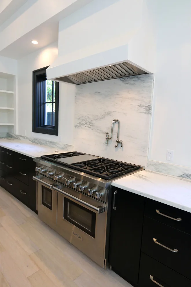 Modern Kitchen Design Featuring a Marble Waterfall Countertop by Classic Cupboards, Inc - Photo 3