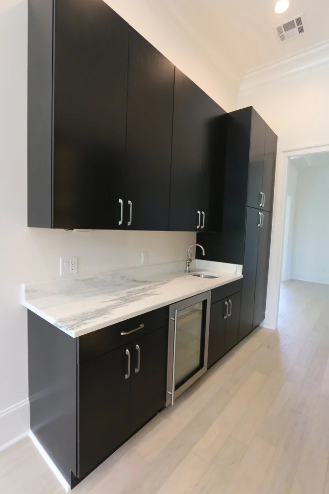 Modern Kitchen Design Featuring a Marble Waterfall Countertop by Classic Cupboards, Inc - Photo 10