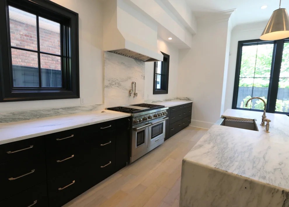 Modern Kitchen Design Featuring a Marble Waterfall Countertop by Classic Cupboards, Inc - Photo 8