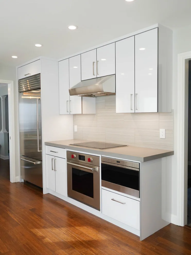 Crestview Sleek White Contemporary Kitchen by Kitchen Inspiration Inc. - Photo 5